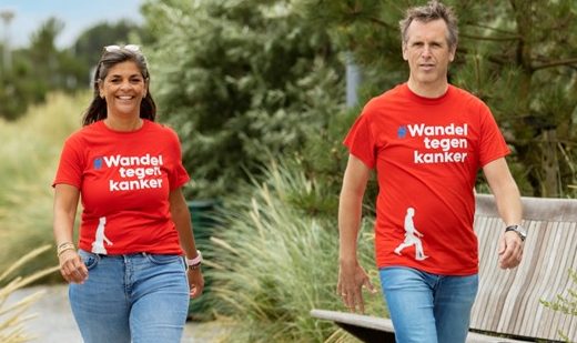 Woman and man walking in Walk against Cancer shirts